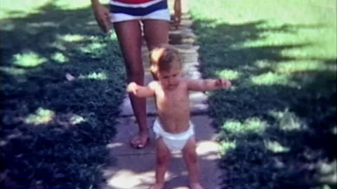 One year old boy learning to walk with mom. Stock Footage 194521799