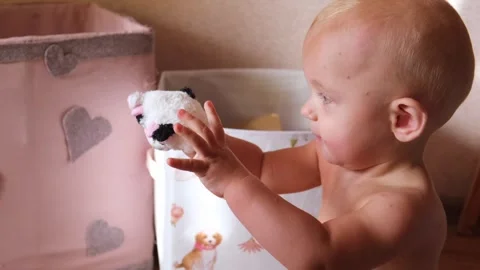 One year old boy plays on the floor with toys at home Stock Footage 252592784