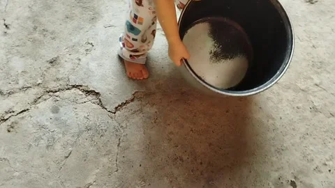 One year old child walking with a pot Stock Footage 218217074