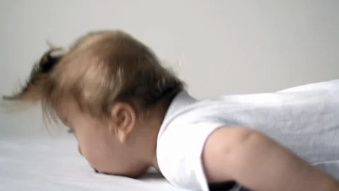 One year old disabled child trying to lift head Video stock 101794358