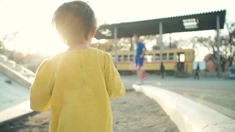 One-year-old kid running at the sunset Video stock 161858554