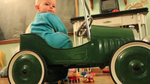 One year old sits in vintage car Stock Footage 41743092