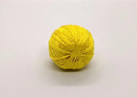 One yellow ball of thread. one yellow ball of thread on a white background si Stock Photos
