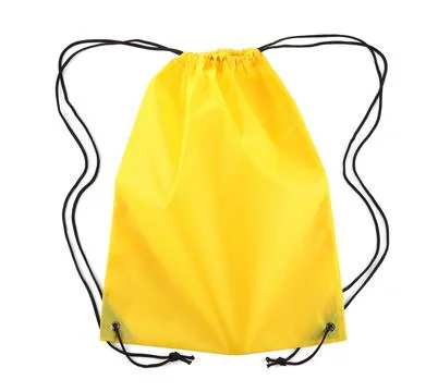 One yellow drawstring bag isolated on white Stock Photos