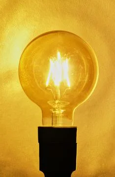 One yellow light bulb Stock Photos