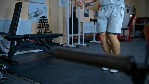 One young athletic man doing double unders jump rope exercise at the gym Stock Footage 81423436