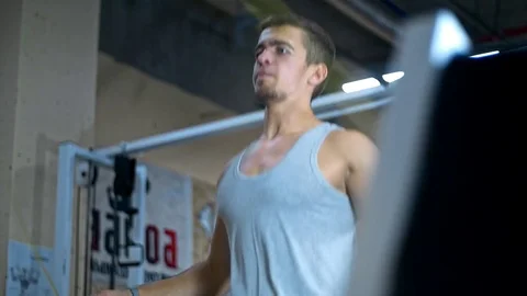 One young athletic man doing double unders jump rope exercise at the gym Stock Footage 81423550