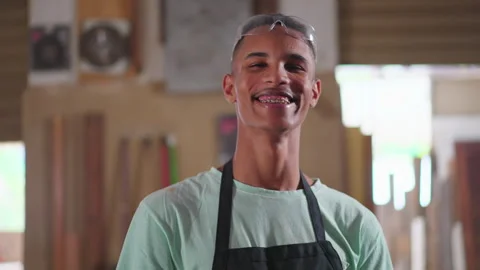 One Young Black Brazilian Apprentice of Carpentry Workshop Taking Notes on .. Stock Footage 247284387