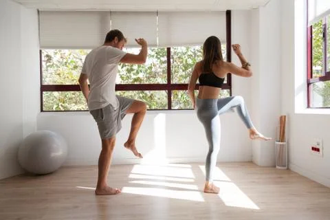 One young couple doing exercise at home Foto stock