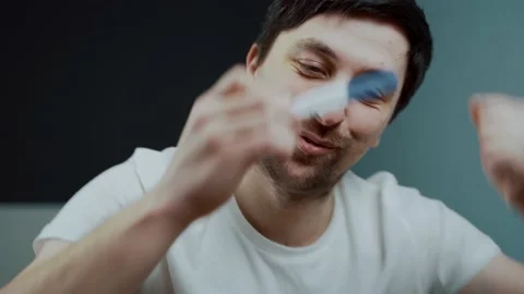 One young guy dancing with joy while looking at pregnancy test. Man not ready Stock Footage 148240952