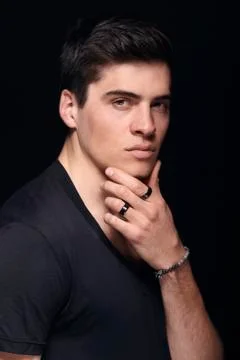 One young handsome man, model wearing t-shirt, simple studio upper body shot, Stock Photos