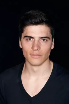 One young handsome man, model wearing t-shirt, simple studio upper body shot, Stock Photos