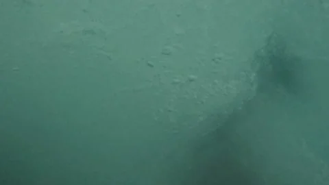 One young happy man jumping off from a cliff to the water doing a back flip h 库存影片 221877369