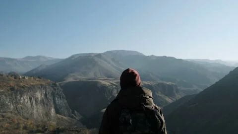 One young hiker spending time by climb and look around close up. Beauty of highl Stock Footage 201097308