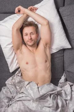 One young man, elevated view, bed sofa laying lying Stock Photos