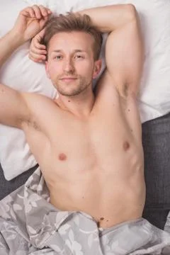 One young man, elevated view, bed sofa laying lying Stock Photos