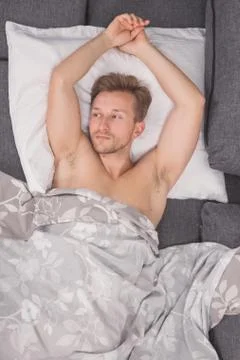 One young man, elevated view, bed sofa laying lying Stock Photos