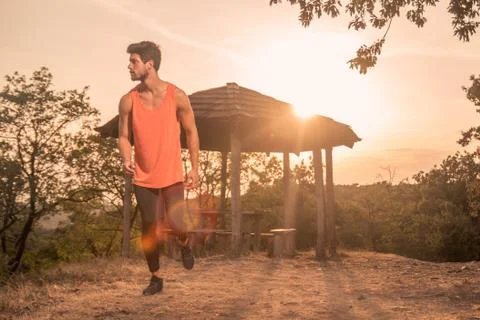 One young man, running, runner, sport clothes, outdoors sunny day Sun, recrea Stock Photos