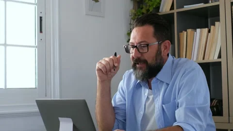 One young man working at home in the office with laptop and notebook taking note Vídeo Stock 151322282