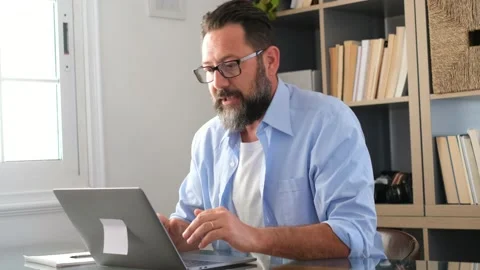 One young man working at home in the office with laptop and notebook taking note Vídeo Stock 151322344