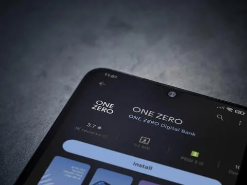 One Zero app play store page on smartphone on a dark marble stone background Stock Photos