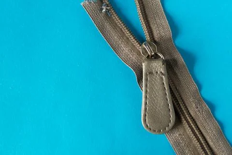 One zipper on blue background Stock Photos
