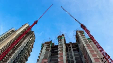 The Ongoing Construction Progress of Towering Skyscrapers with Cranes Under.. Stock Photos