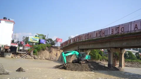 Ongoing infrastructure work during natural disaster in India Stock Footage 321042362