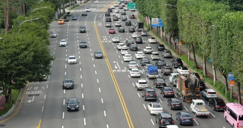 Ongoing lanes almost empty, and slow crowded traffic at outgoing lanes Stock Footage 295028617