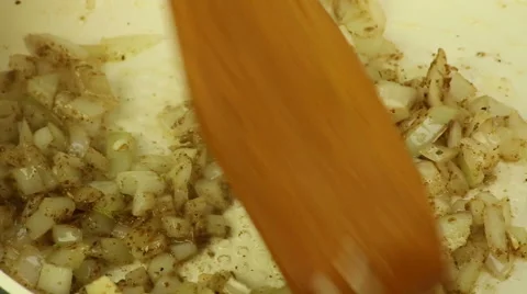 Onion and herbs being fried in olive oil Stock Footage 67584538