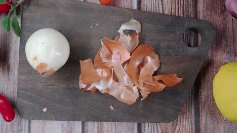 Onion and Peel on Rustic Cutting Board with Lemon and Shallots Flat Lay Kitchen Stock Footage 332964239