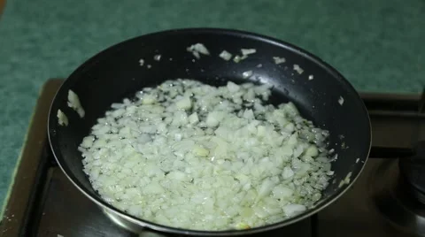 Onion are fried in pan Video stock 64960248