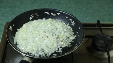 Onion are fried in pan Video stock 64960657