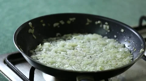 Onion are fried in pan Video stock 64960986
