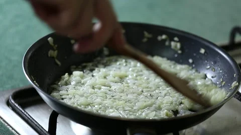 Onion are fried in pan Video stock 64961258