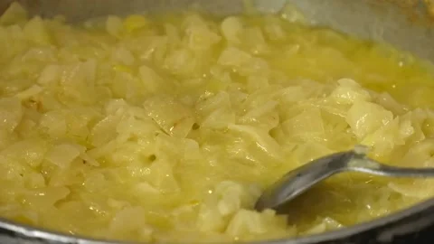 Onion being fried on a pan. Cooking at home concept Stock Footage 172062868