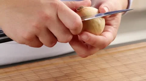 An onion being peeled Stock Footage 24672621