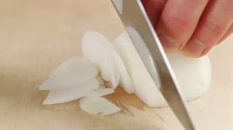 An onion being sliced 스톡 동영상 24653235