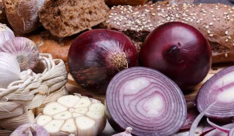 Onion, bread and garlic Stock Photos