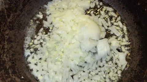 Onion is cooked on the fire in a pan Video stock 221271354