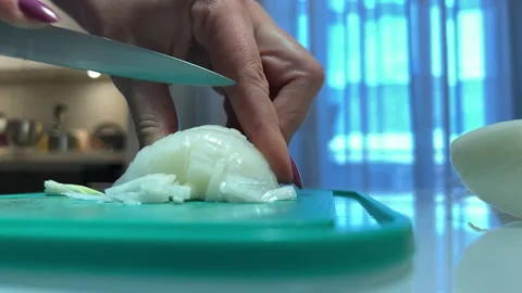 Onion is cut with knife on the table Video stock 221202179