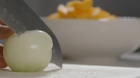 Onion cut in slow motion Stock Footage 116898179
