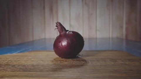 Onion on cutting board Stock Footage 73816267