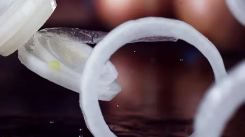 Onion Falling in Super Slow Motion (1000fps)" Description: "Witness the mesmeriz Stock Footage 253299016