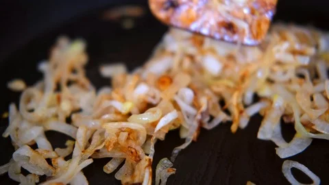 Onion fried in the pan Stock Footage 128413524