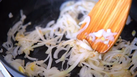 Onion fried in the pan Stock Footage 128413568
