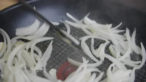 Onion is fried in a pan Stock Footage 131366281