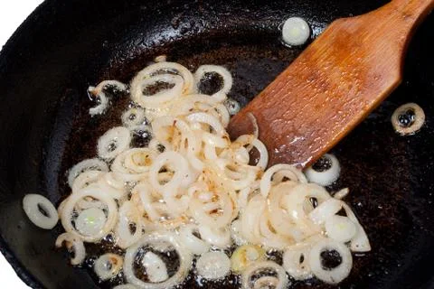 Onion fried in a pan Stock Photos