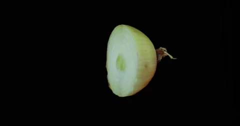 Onion half rotating with black background Stock Footage 233580330