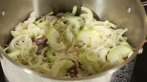 Onion with meat stirs in a pot Stock Footage 49783513